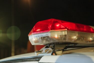 close up photo of police siren. A peace officer can direct you to pull over in Alberta, Canada.