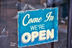 Open sign. Some Alberta registries are open on weekends.