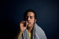 A man smoking. Marijuana use is legal in Alberta since the passing of the Canadian Cannabis Act.