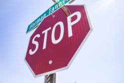 red and white stop sign. running a stop sign in alberta will get you 3 demerits.