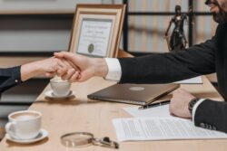 contract lease deal handshake at desk. Ending a lease in alberta notice times vary by lease.
