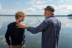 an elderly man holding his grandson s shoulder while looking at him. You need a win card to fish in alberta, canada.