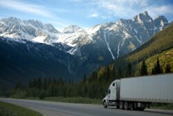 Semi truck in Alberta rocky mountains. We discuss how to get a class 1 license in Alberta, Canada.