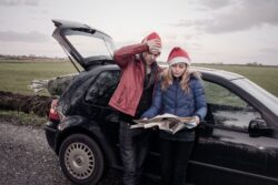 couple wearing santa caps planning a cross border trip. Montana is the only state that borders alberta canada.