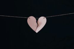 broken heart hanging on wire. Discussing what legal separation is in alberta.